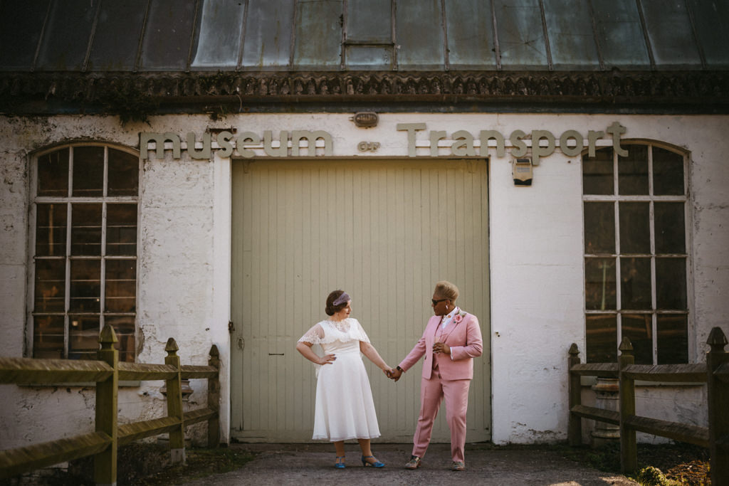 Transport sign two brides hold hands underneath