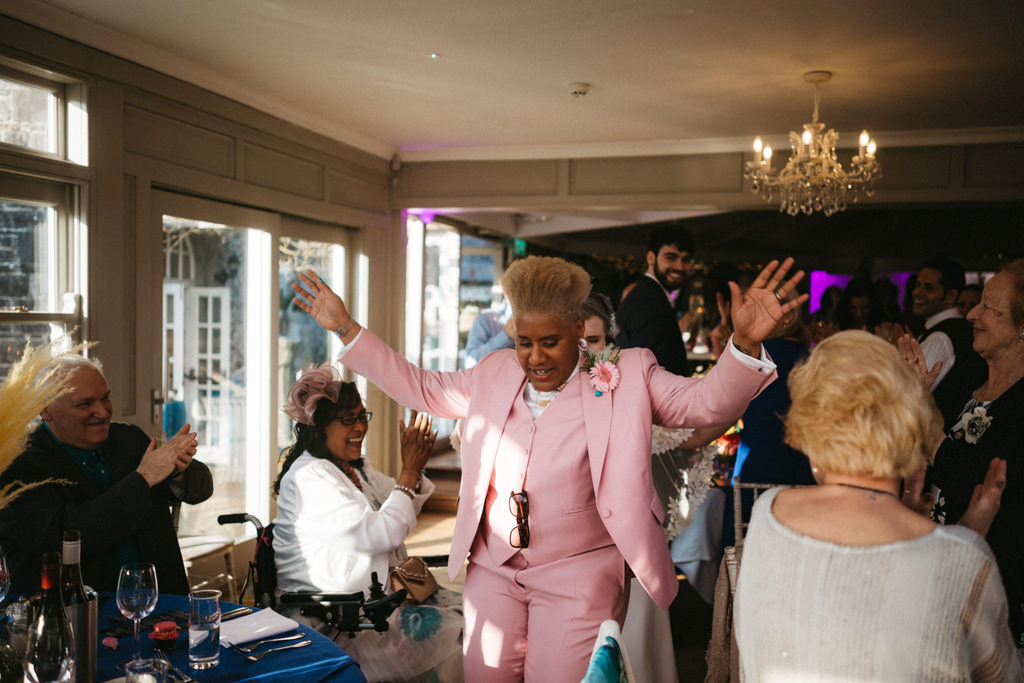 Bride enters ballroom guests clap