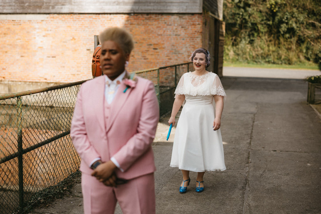 Bride makes her way to bride and surprises her nervous bride awaits