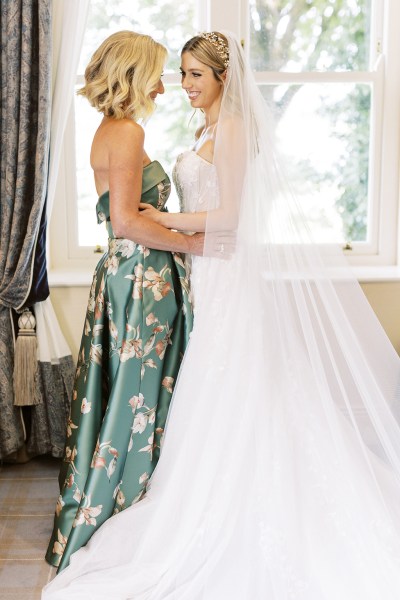 Bride and mother getting ready together