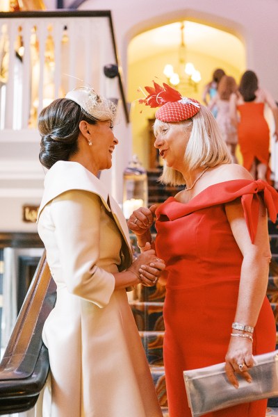 Mother and woman in red chatting