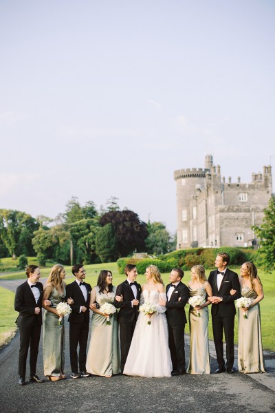 portrait shot of bride groom bridesmaids and groomsmen on pathway