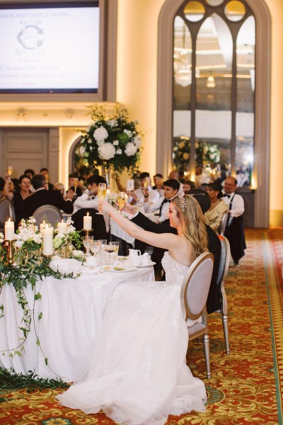 Atmosphere shot of ballroom and guests cheers