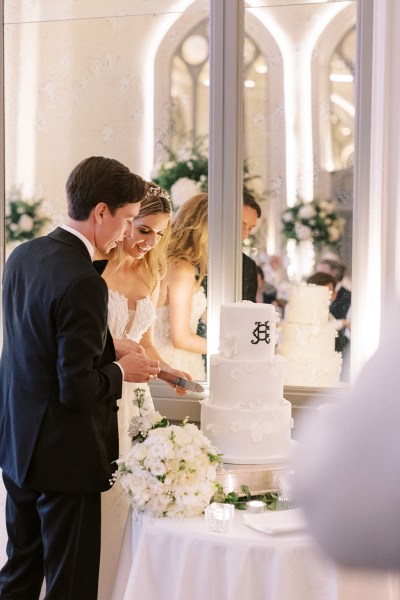 Bride and groom enjoy the wedding cake together