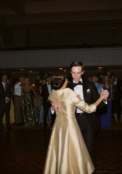 Groom dances with mother on dancefloor