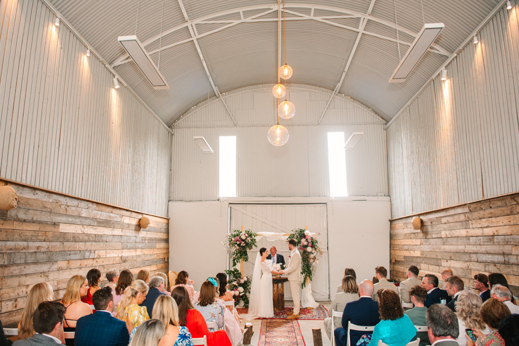 Ceremonial room with guests and couple