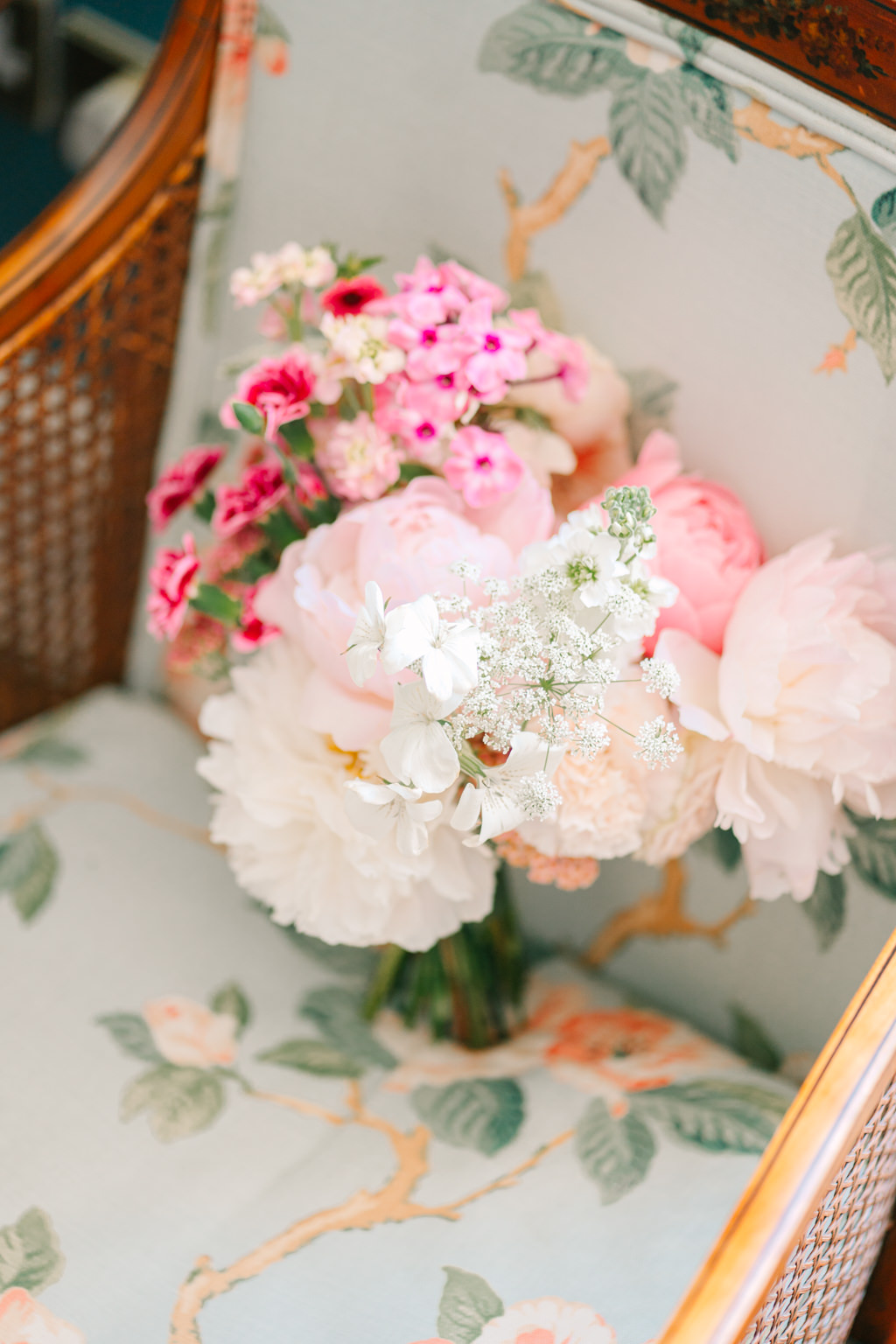 Close up of bouquet flowers resting on sofa chair