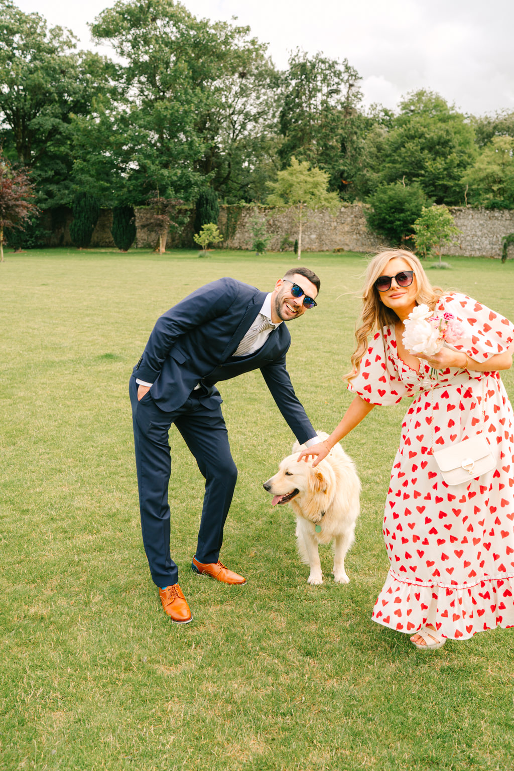 Guests pet the happy Labrador dog