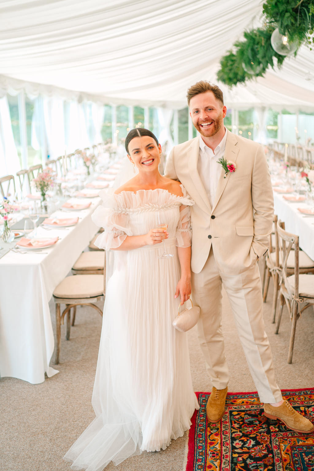 Bride and groom stand in dining room it's empty