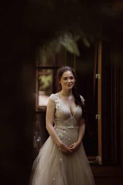 Bride ready dark shot in her bridal wedding dress/gown