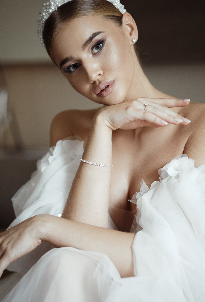 bride wearing a headpiece posing