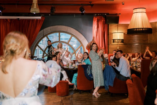 Bride approaches family members in