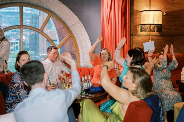 Family members guests celebrating at dining table