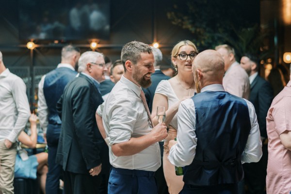 Men guests chatting together