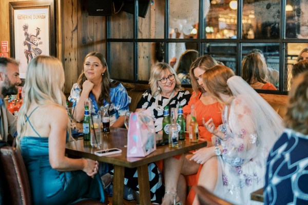 Women sitting with bride at table