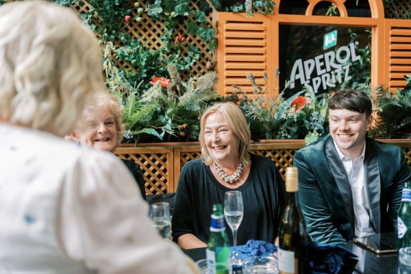 Woman laughing at table