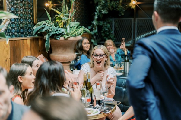 Guest laughs at table