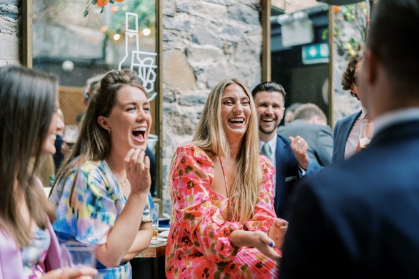 Three women laugh