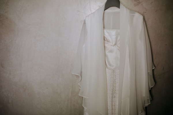 White bridal gown dress hanging up