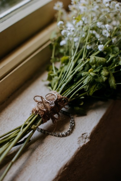 Bouquet flowers resting on windowsill