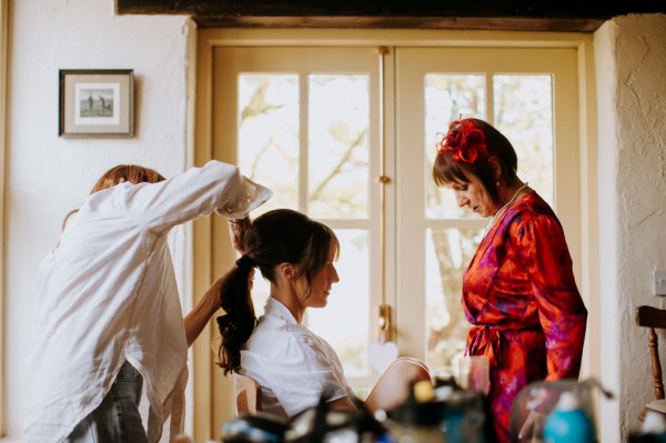 Bride getting her hair done hairstylist