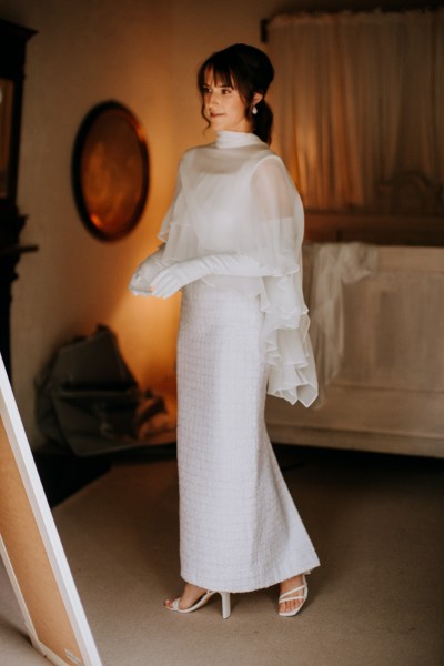 Bride standing in front of mirror ready