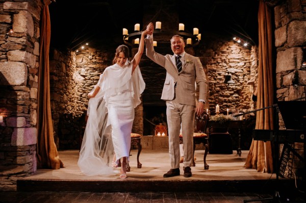 Bride and groom hands in the air