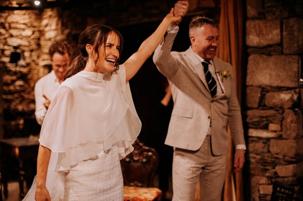 Bride and groom hands in the air