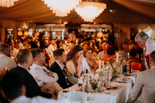 Atmosphere shot of guests seated at dining room table