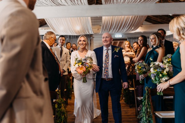 Father of the bride walks daughter down the aisle