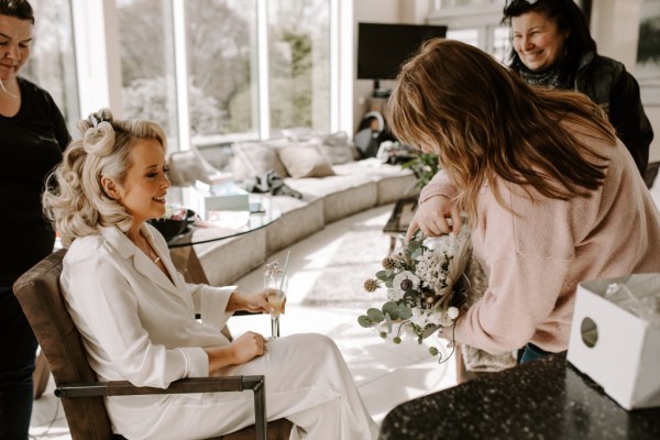 Bridesmaid and bride chatting