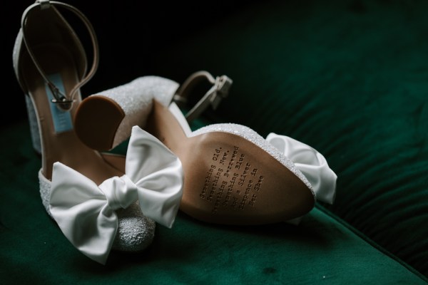 Bottom of white bridal heels shoes bow detail