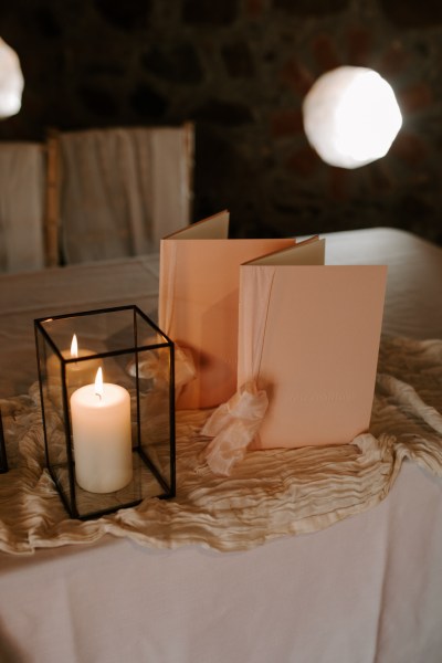 Cards menu and candles lit in lanterns