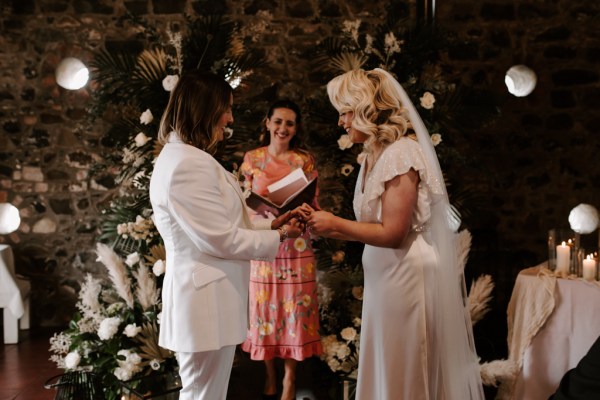 Bride reads her vows to her bride and to guests