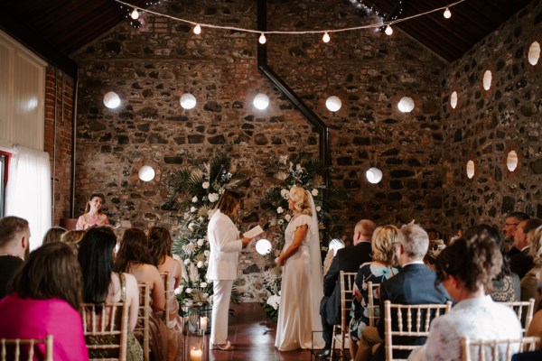 Bride reads her vows to her bride and to guests