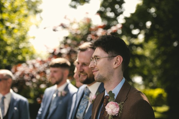 Groom and his groomsmen wait for the bride