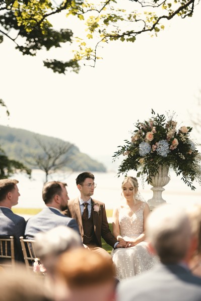 Bride and groom at top of alter during ceremony