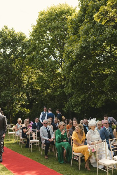 Guests are seating during ceremony red carpet