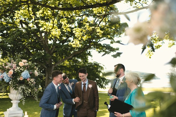 Groom stands at the alter as he awaits the bride