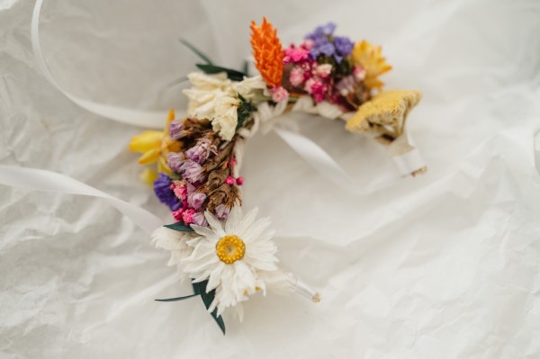 Flower headband lying on bed sheets