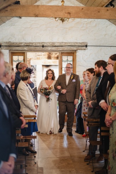 Father of the bride walks his daughter down the aisle