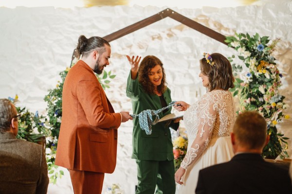 Celebrant bride and groom at alter