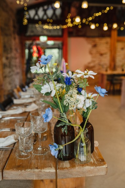 Blue flowers daisies on table in ballroom setting