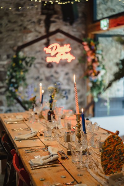 Candles lit on the table in ballroom decor