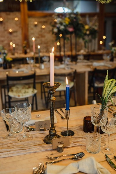 Candles lit on the table in ballroom decor