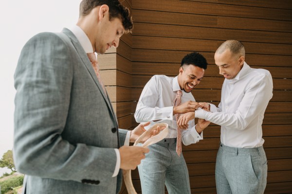 groom and groomsmen get ready together