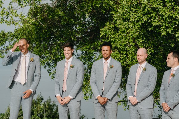 groom and groomsmen await the bride