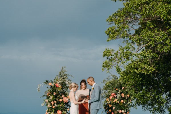 bride and groom at the alter with celebrant