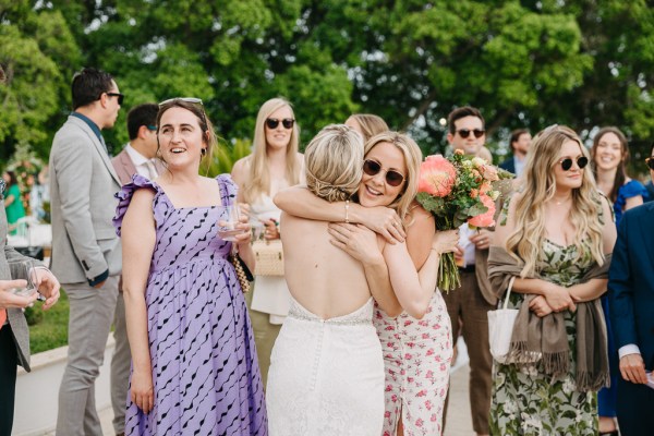 bride and friend hug embrace