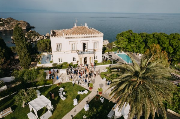 drone shot view of wedding venue swimming pool ocean mountains and landscape